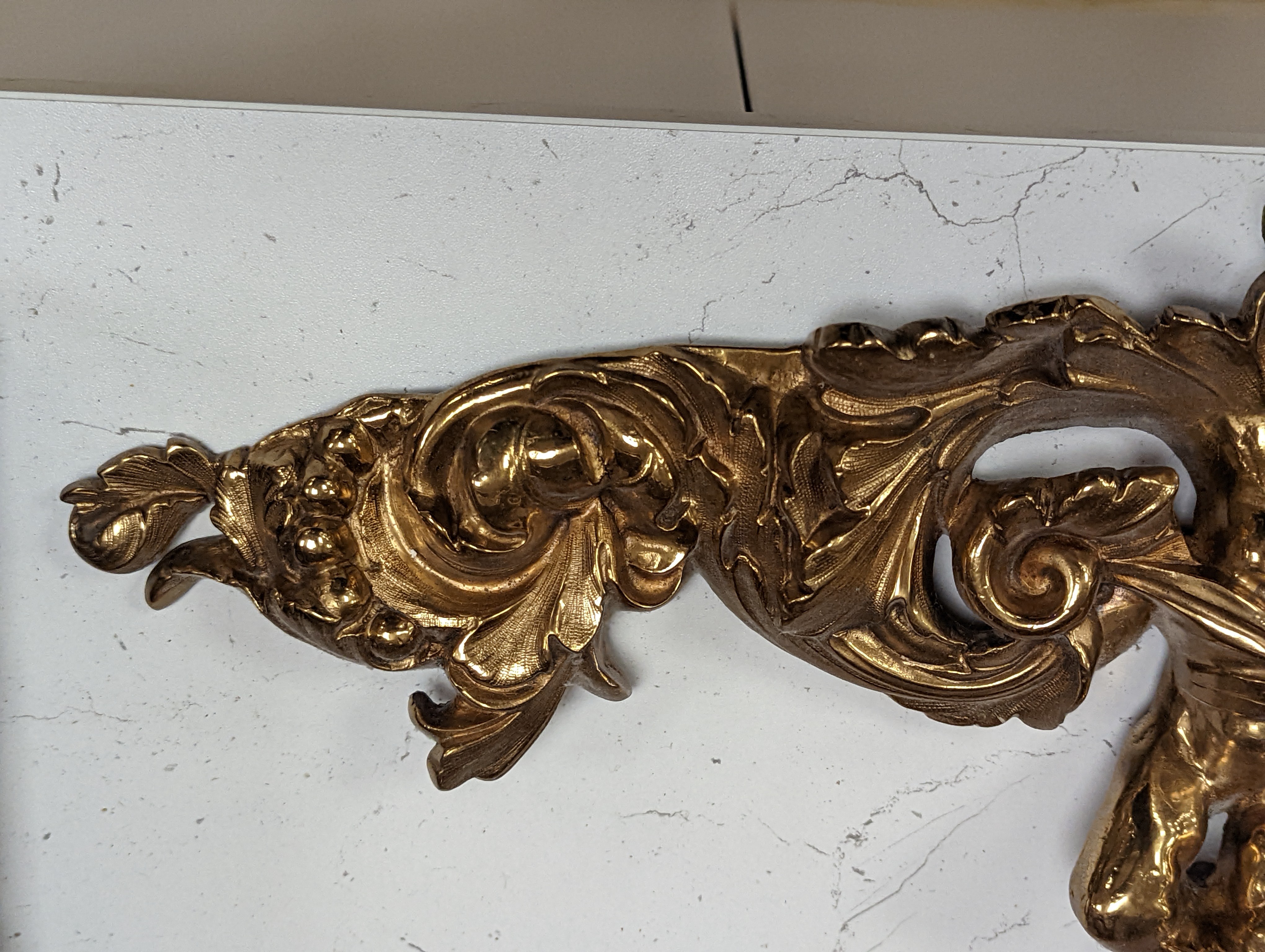 A pair of ormolu and cut glass twin branch wall lights, a bag light and a brass mount